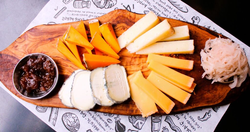 Beautiful serving of cheese on the board